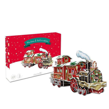 a christmas train is shown in front of a box