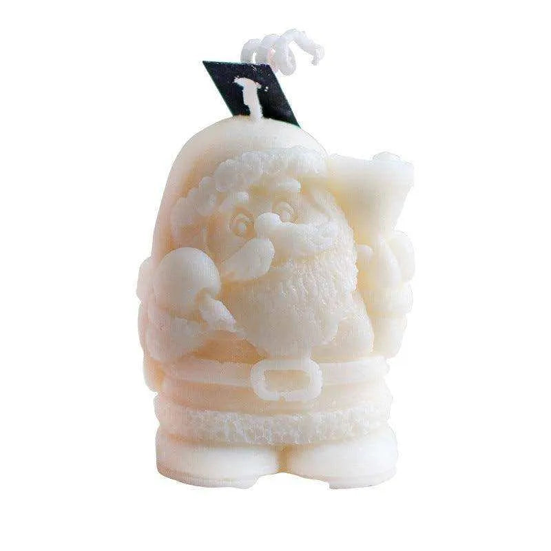 a white santa clause candle with a black top