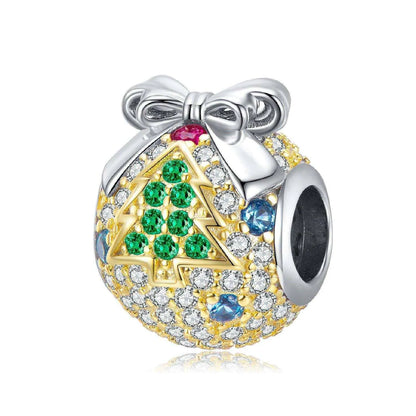 a charm with a christmas tree on it