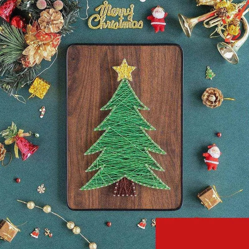 a christmas tree made out of string on a cutting board