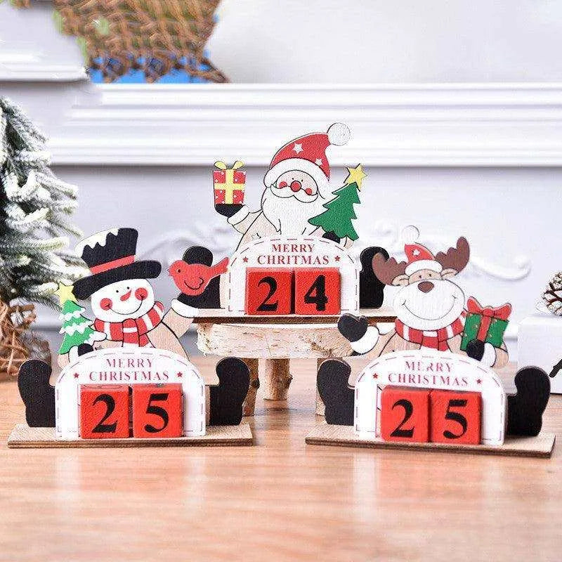 a group of wooden christmas decorations sitting on top of a wooden table