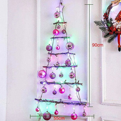 a small christmas tree with lights and ornaments