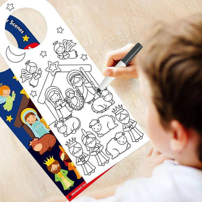 a child is drawing a nativity scene on a door hanger