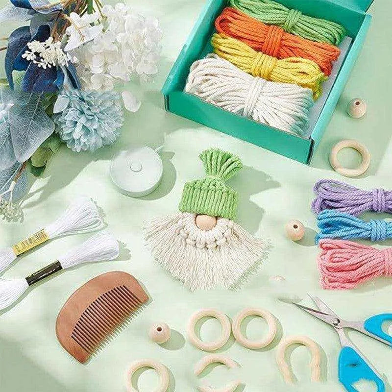 a box of yarn, scissors, and other craft supplies