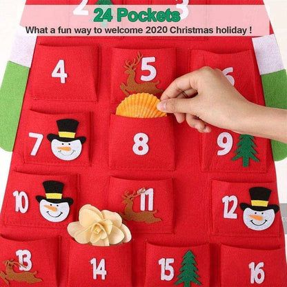 a person is putting a paper snowman on a christmas calendar