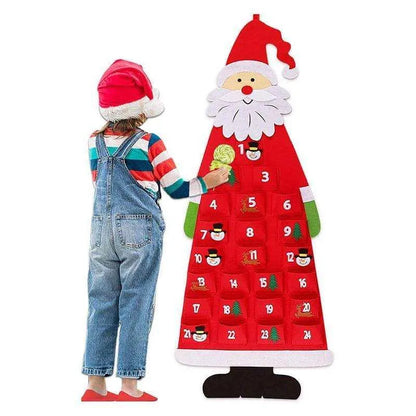 a child in overalls standing next to a christmas calendar