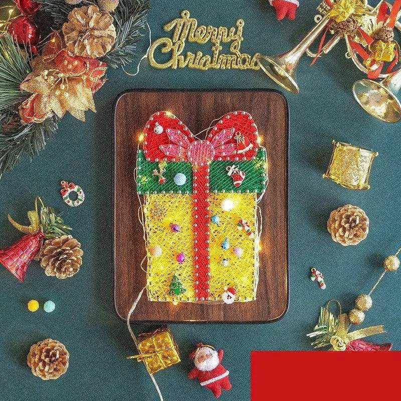 a decorated christmas cookie on a tray surrounded by christmas decorations