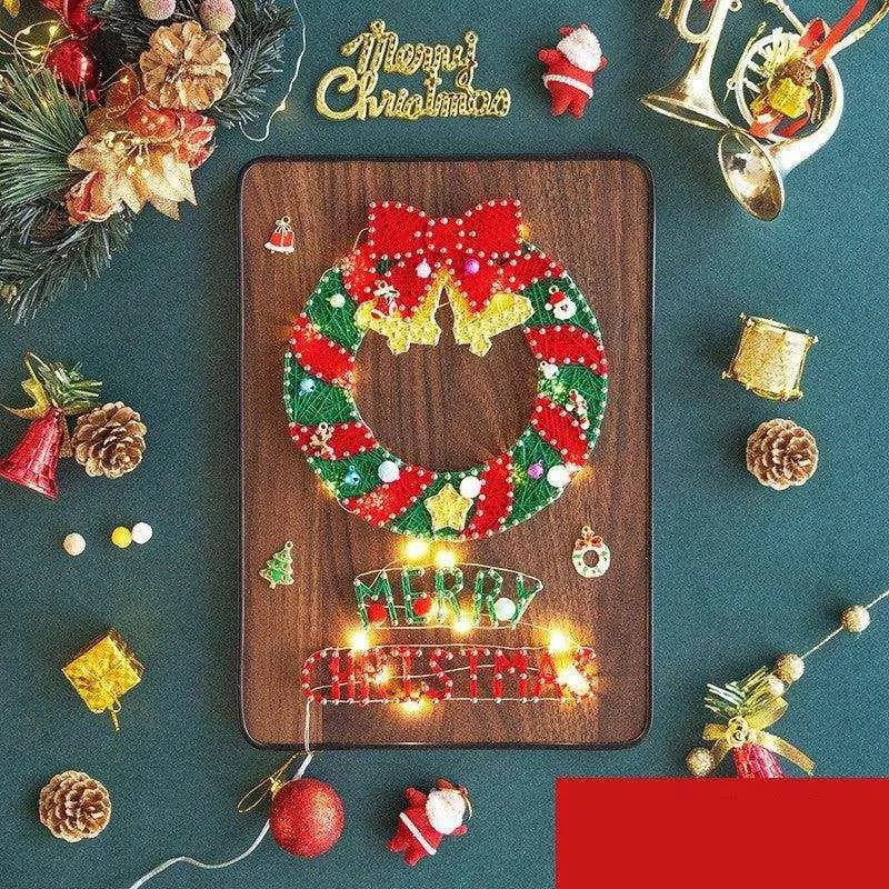 a christmas wreath made out of beads on a wooden board