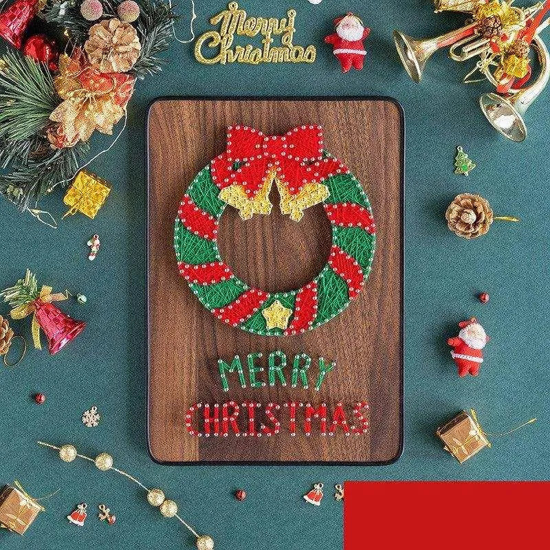 a merry christmas decorated cookie on a wooden board