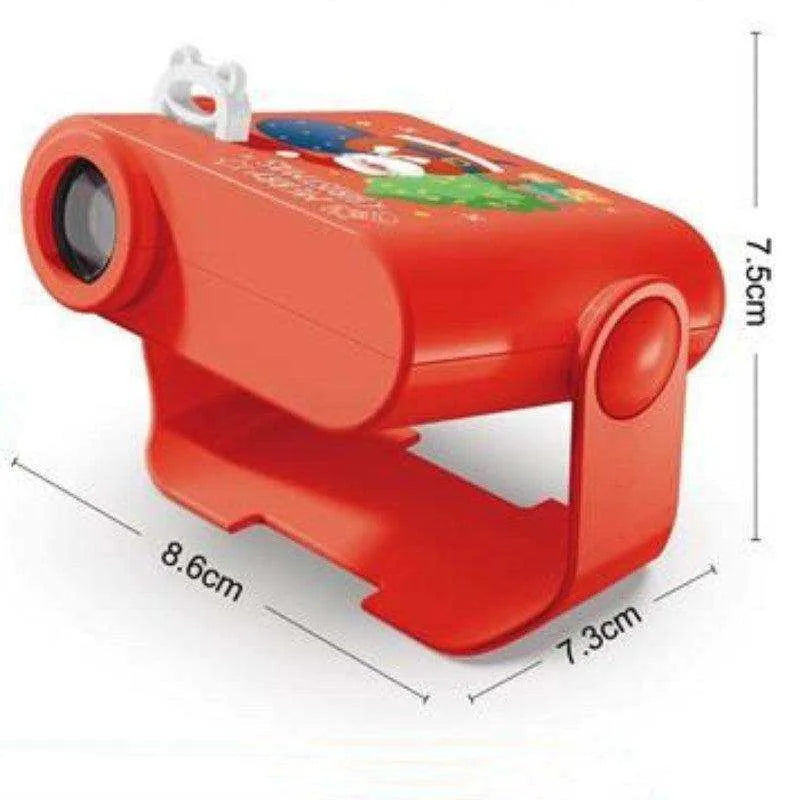 a red toy camera sitting on top of a table