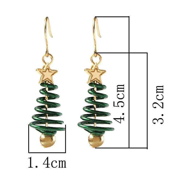 a pair of christmas tree earrings with a star on top