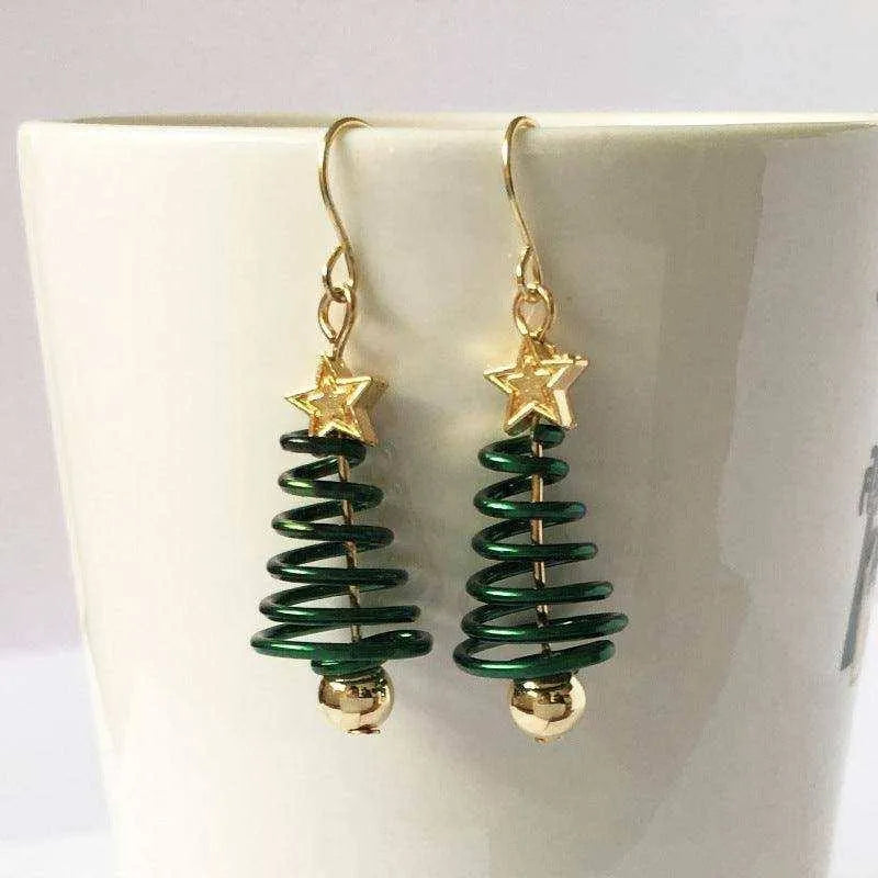 a pair of green and gold christmas tree earrings