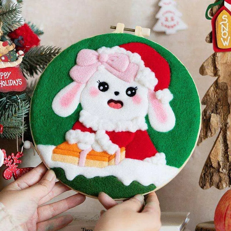 a person holding a christmas ornament in front of a christmas tree