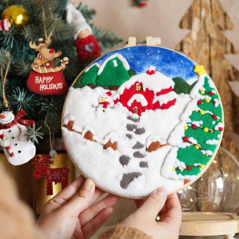 a person holding a decorated christmas ornament in front of a christmas tree