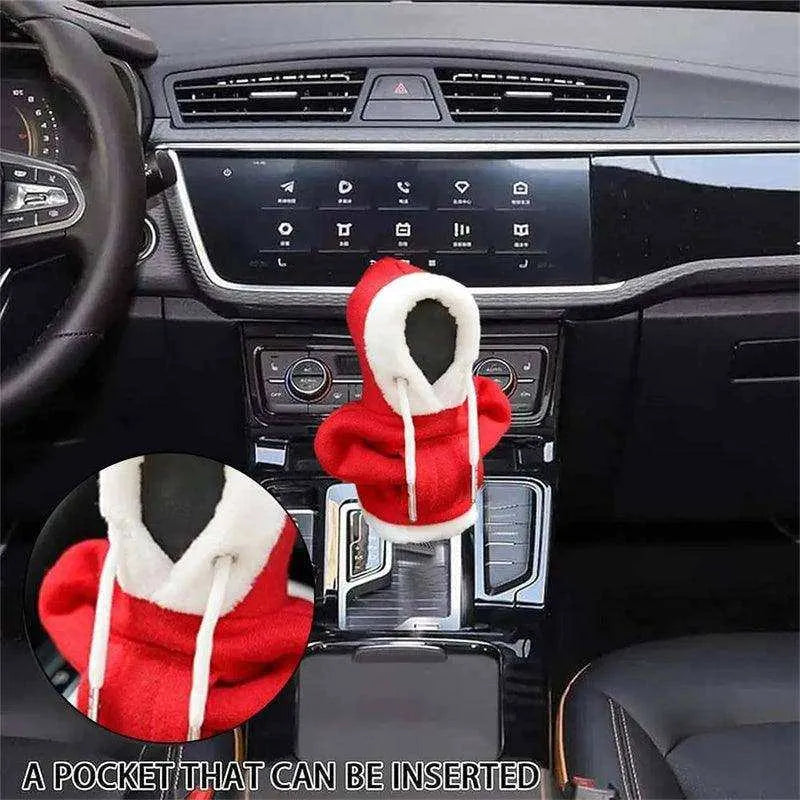 a car dashboard with a steering wheel and a santa claus hat