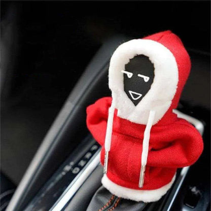 a red and white hoodie with a black face on it