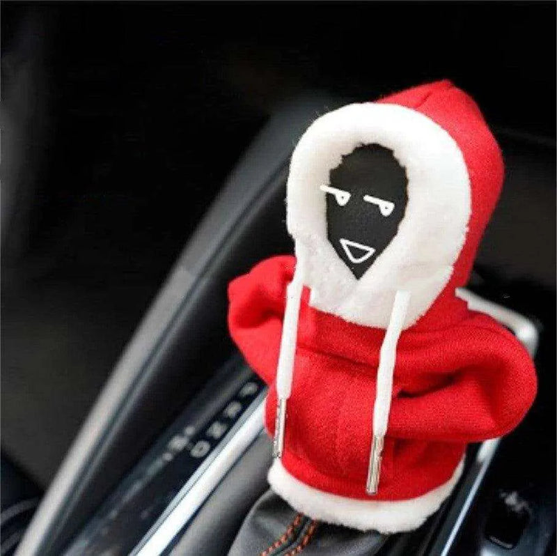 a red and white hoodie with a black face on it