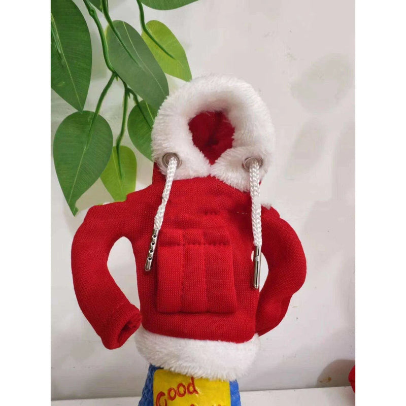 a stuffed animal wearing a red jacket and hat