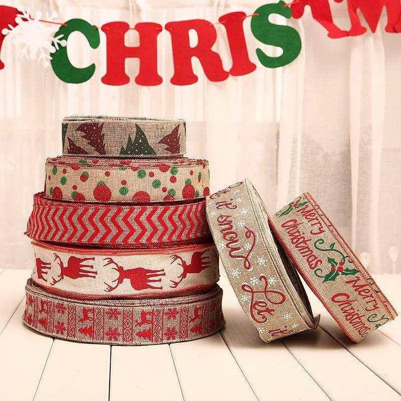 a stack of christmas ribbon sitting on top of a table