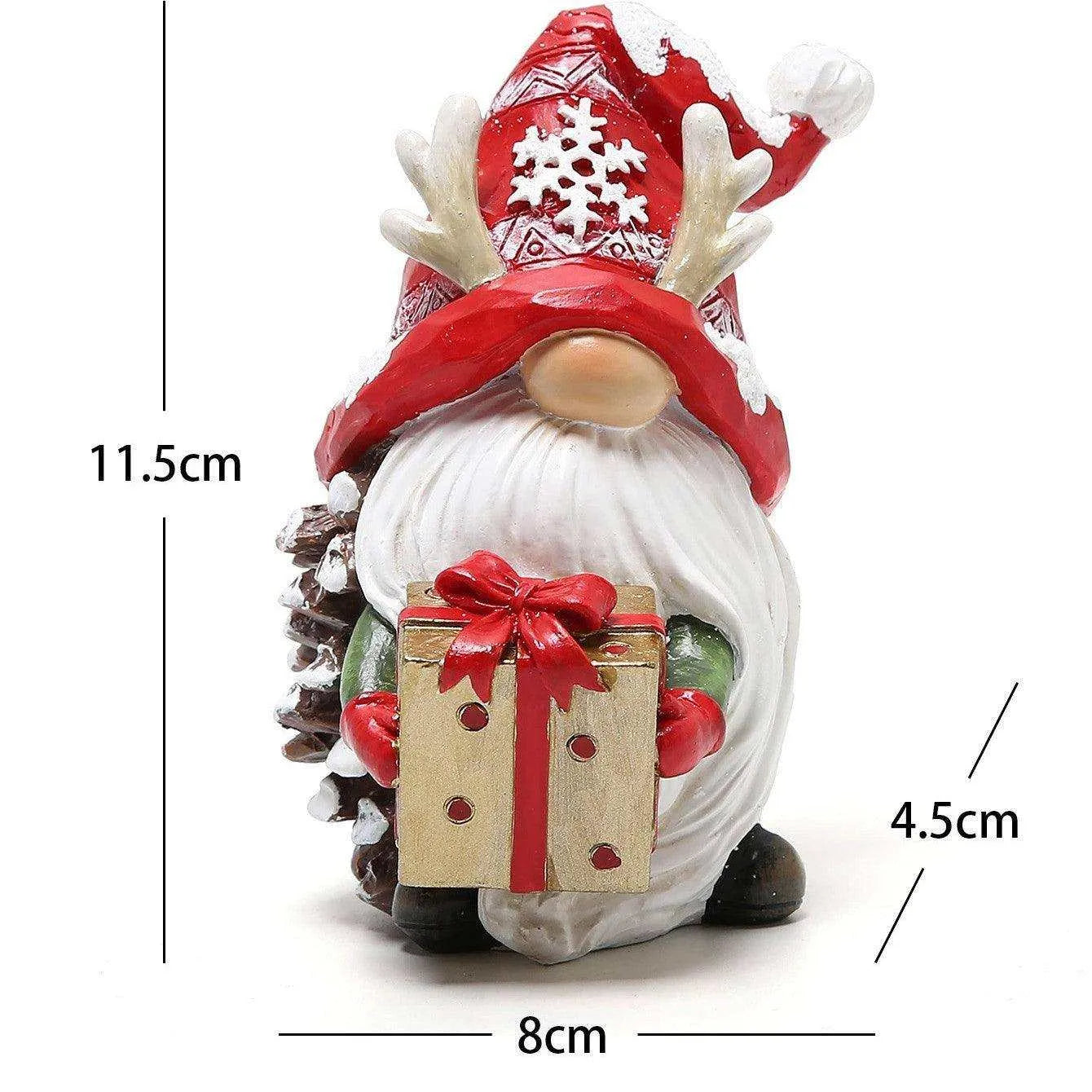 a santa claus figurine with a gift box