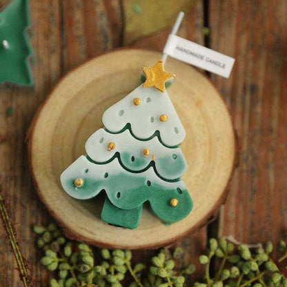 a cookie shaped like a christmas tree on a plate