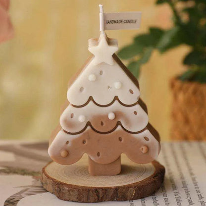 a small ceramic christmas tree on a wooden slice