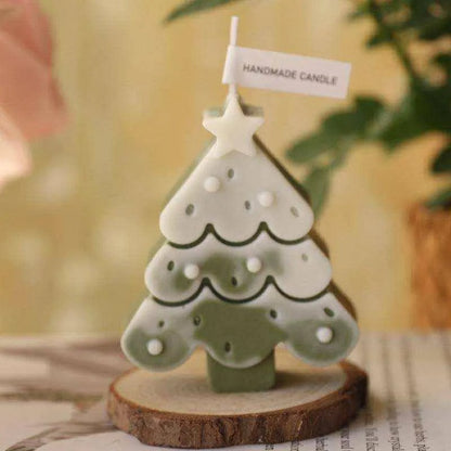 a small ceramic christmas tree on a table