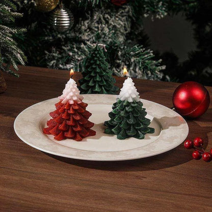 a white plate topped with christmas trees on top of a table