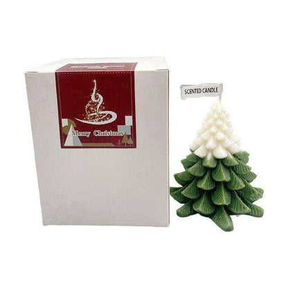 a small white christmas tree next to a box