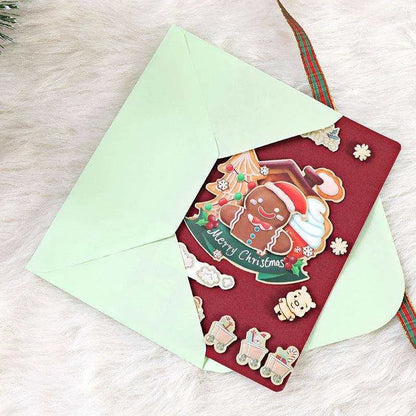 a red envelope with a christmas card inside of it