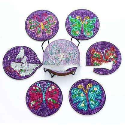 a set of six coasters with different designs on them