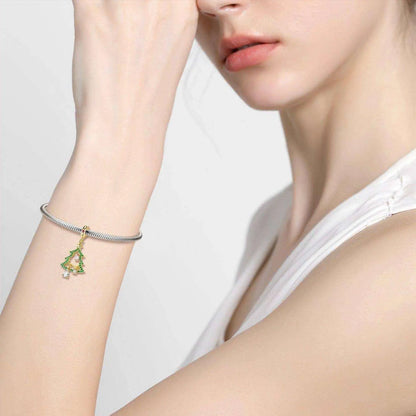 a woman is wearing a bracelet with a flower on it