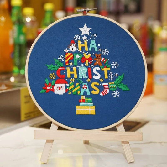 Christmas embroidery kit with hoop, canvas, and festive threads