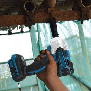 a person holding a cordless drill and a cordless drill